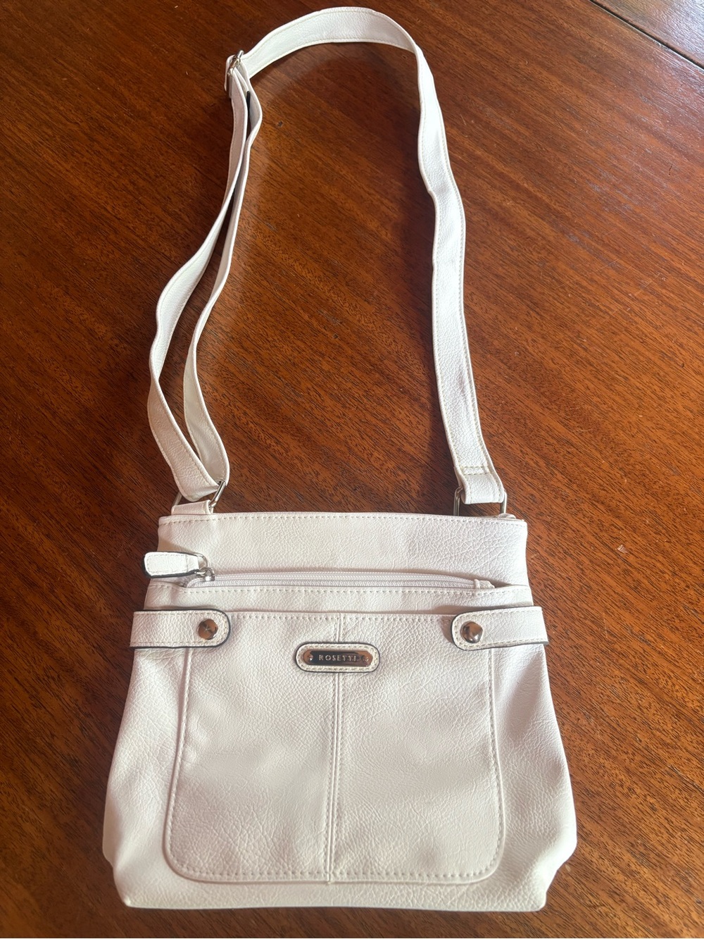 Rosetti White Cream Crossbody with Front Zip and Plaque